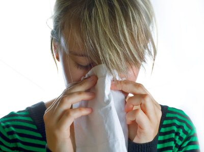 Woman sneezing